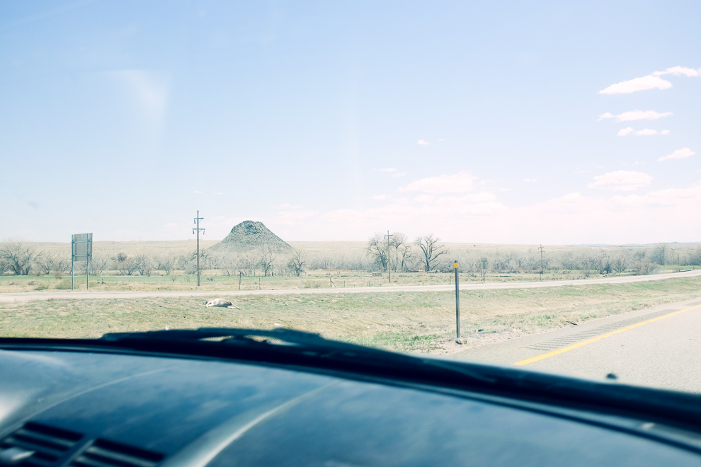 10 miles north of Walsenburg, you pass Huerfano Butte, a volcanic plug it is believed. Huerfano is spanish and means "orphan".